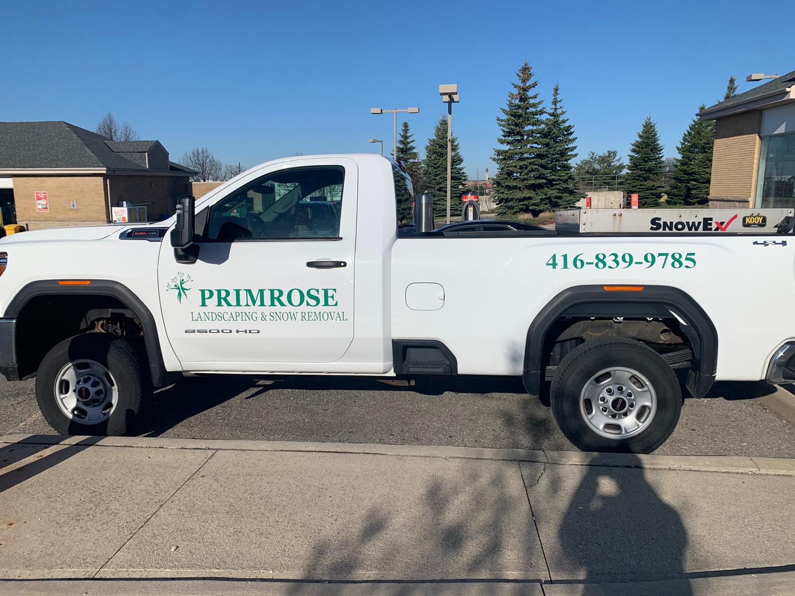 White truck with Primrose Landscaping and Snow Removal Logo